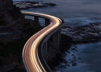 time lapse photo of cars on a highway at night